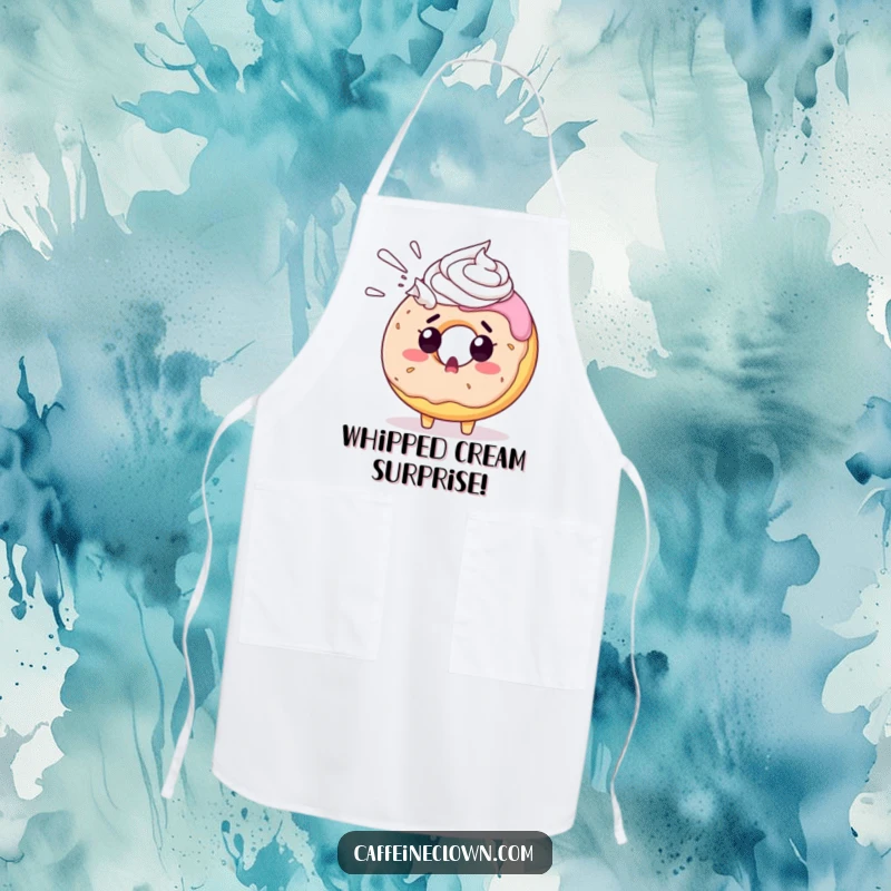 Funny donut apron showing a surprised donut character being sprayed with whipped cream, a comedic kitchen essential.