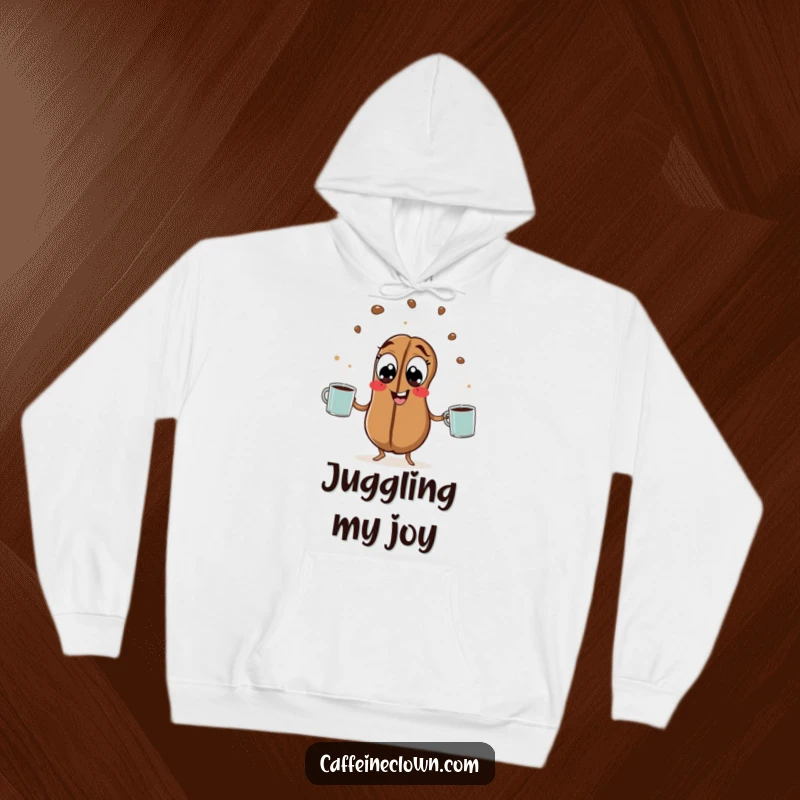 Funny Coffee Bean Hoodie: A hyperactive coffee bean with wide eyes juggles steaming mugs, offering cozy comfort and funny energy.